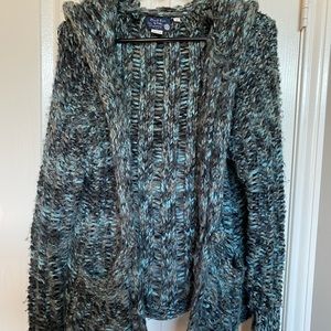 Beautiful jeweled-blue knit sweater with pockets, hood, and 1 button closure.